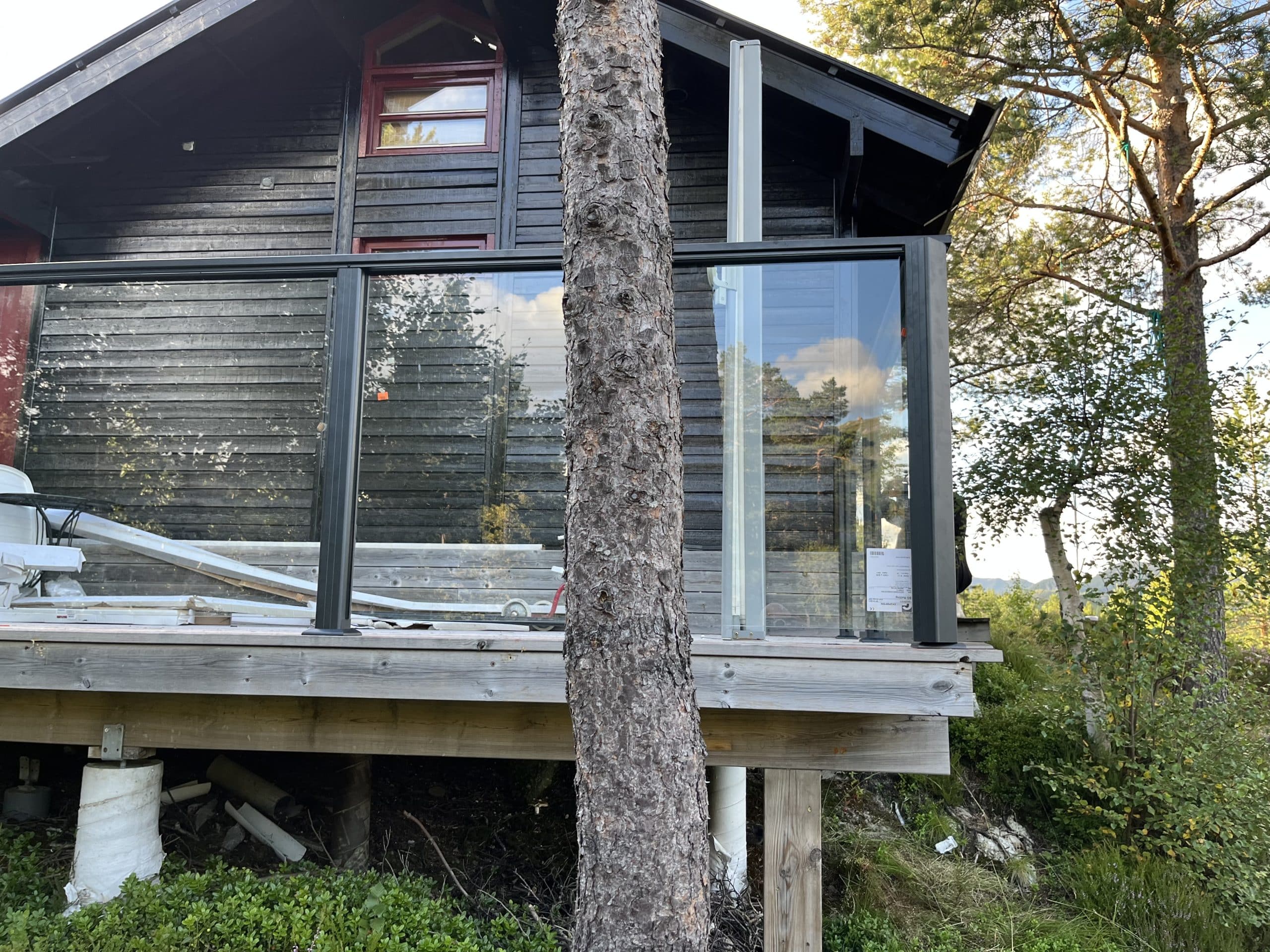 Wooden cabin with glass railing