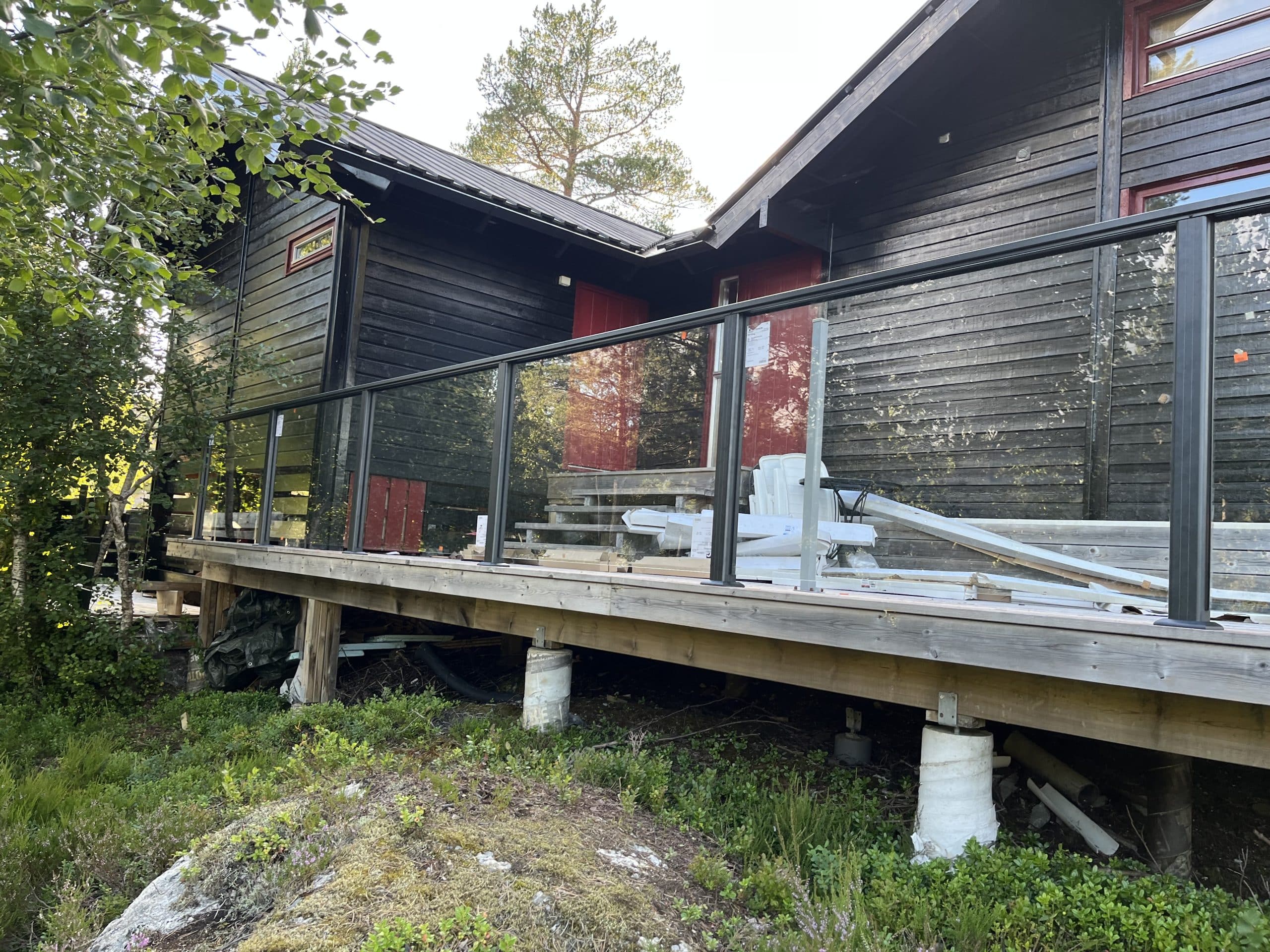 Black wooden house with deck