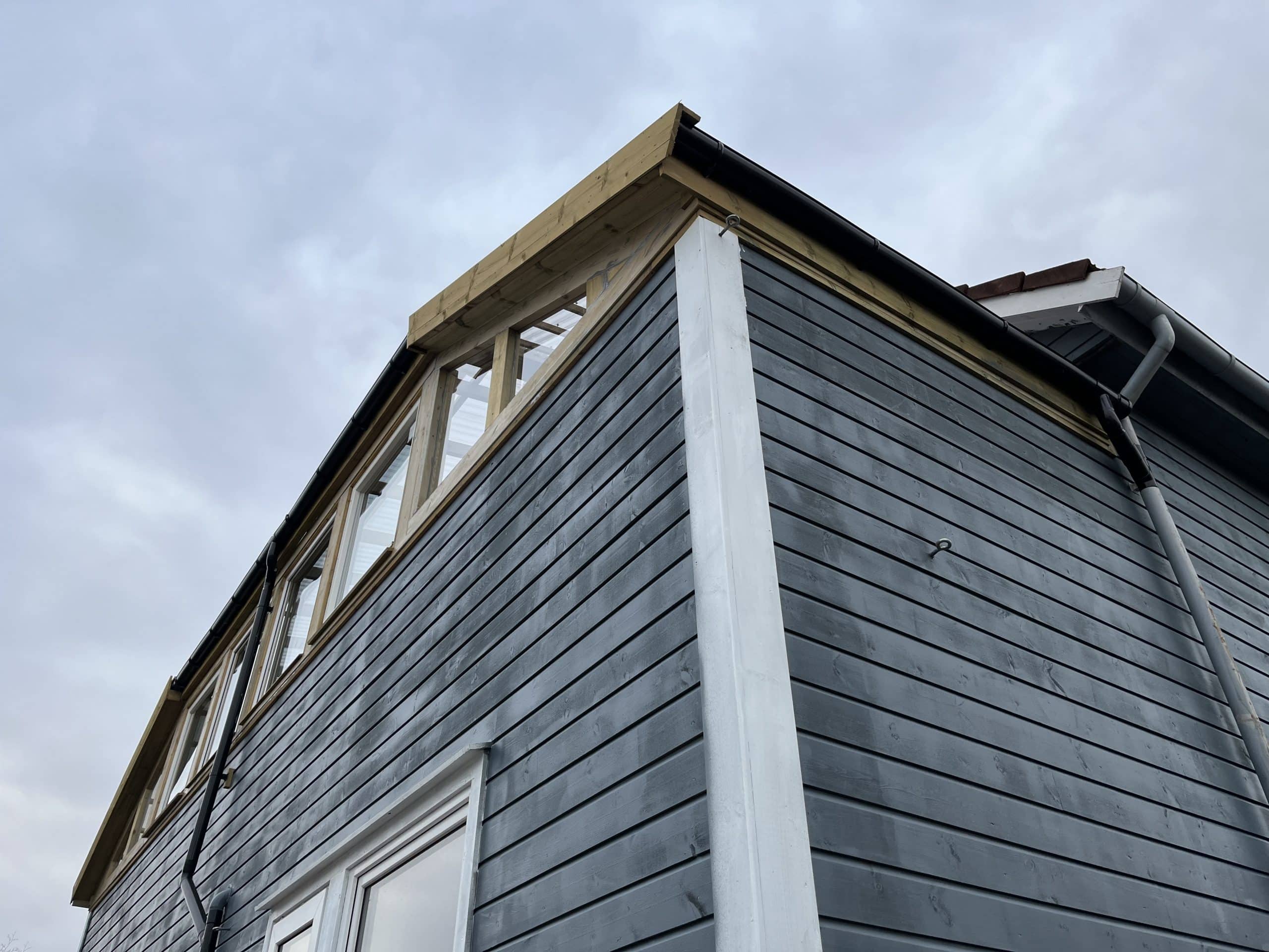 House under construction with cloudy sky