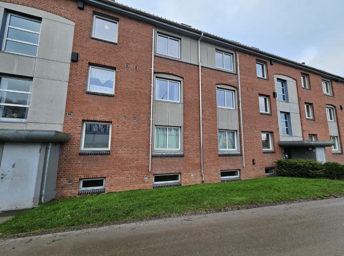 Modern brick apartment building exterior.