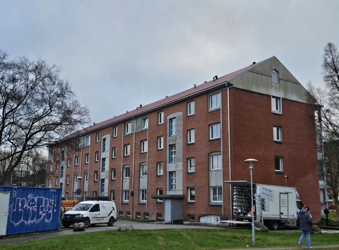 Brick building with cloudy sky