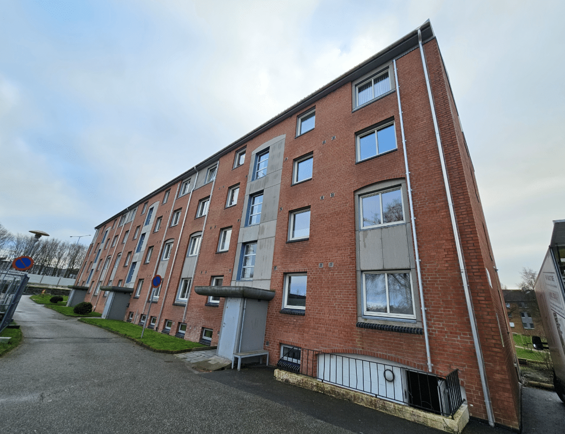 Red brick apartment building with windows