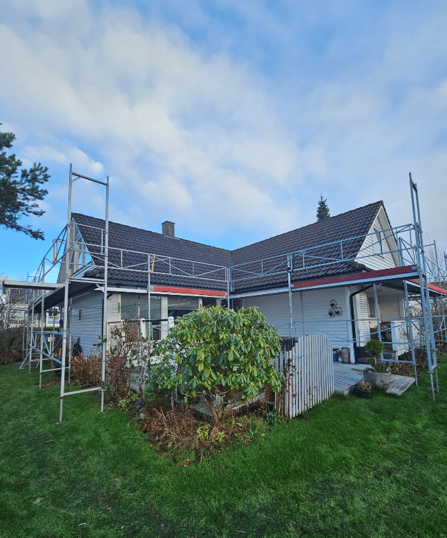 House under construction with scaffolding.